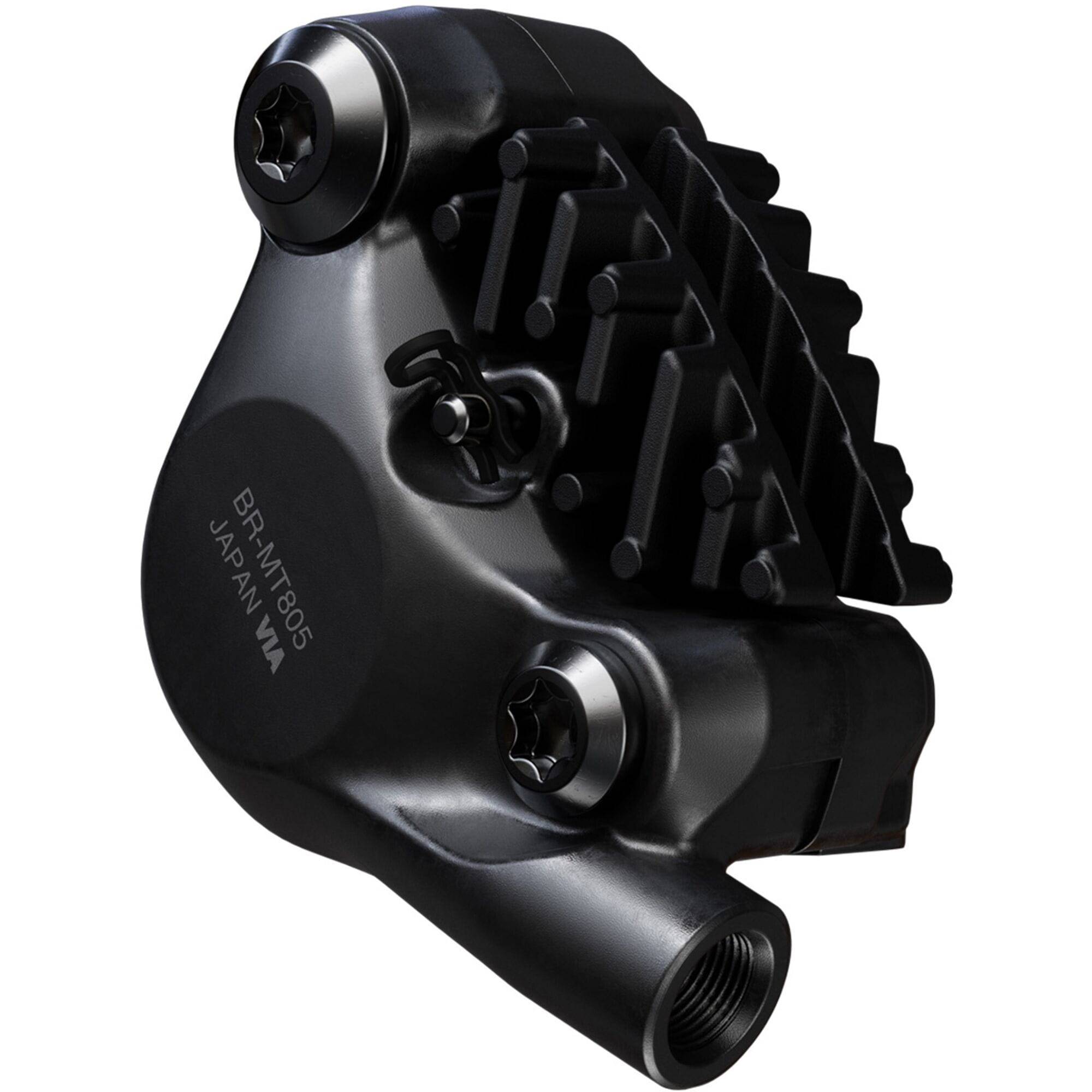 Shimano Deore XT BR-MT805 rear 2-pot flat mount disc brake caliper for bikes, shown in black with mounting hardware.