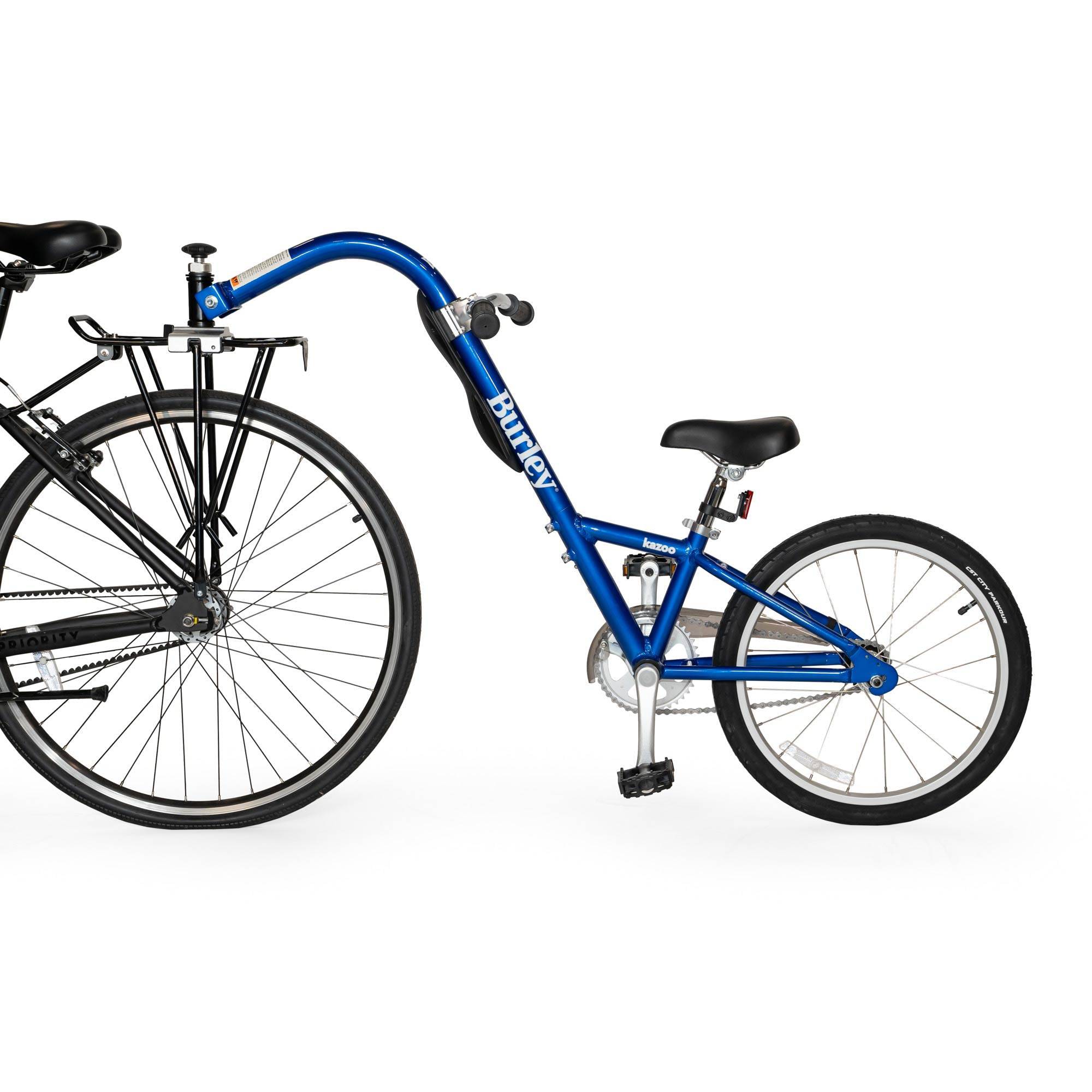 Burley Kazoo kids bike trailer with adjustable handlebar and safety flag, designed for family cycling adventures.