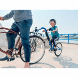 Burley Kazoo kids bike trailer with adjustable handlebar and safety flag, designed for cycling with children and easy attachment.