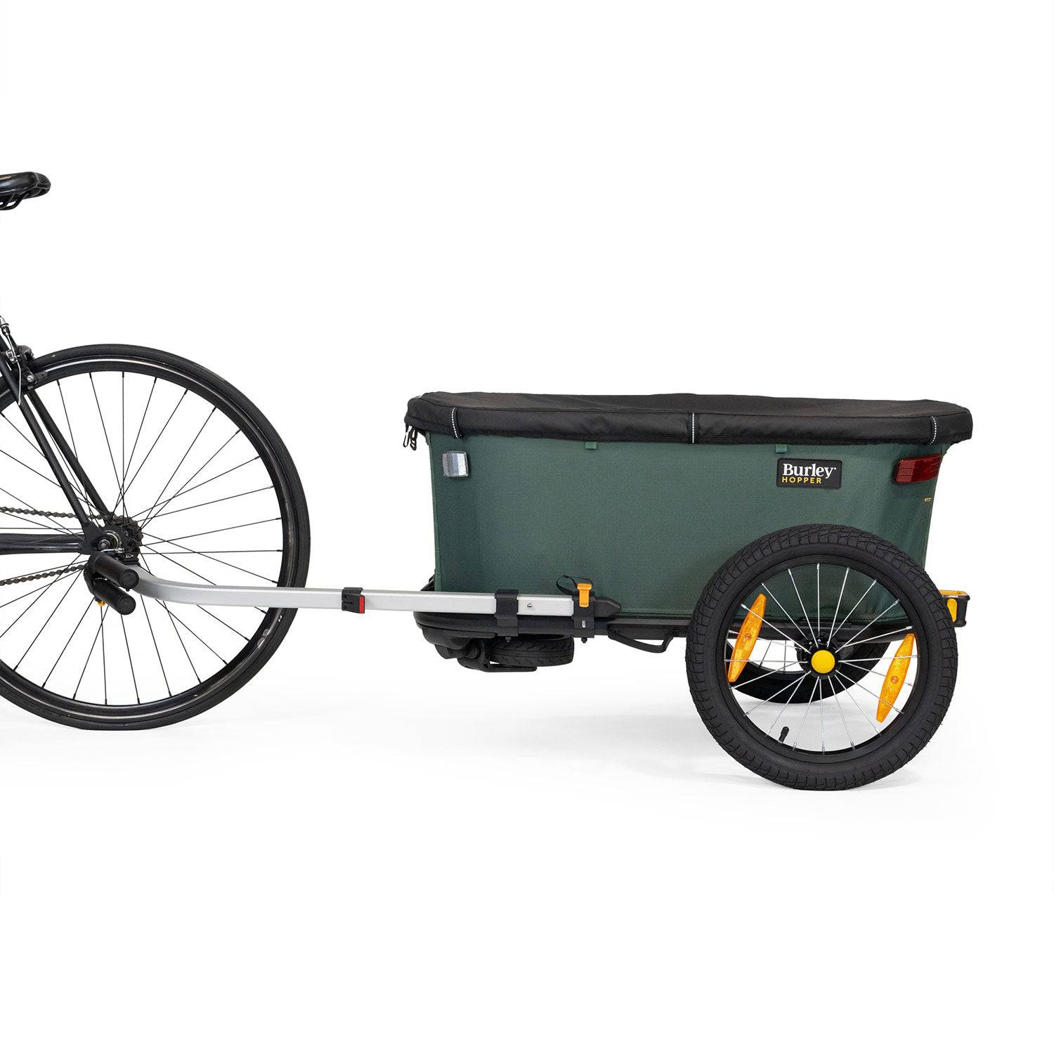 Burley Hopper bike trailer and wagon showing its durable outdoor cargo carrier design and compact, versatile accessories.