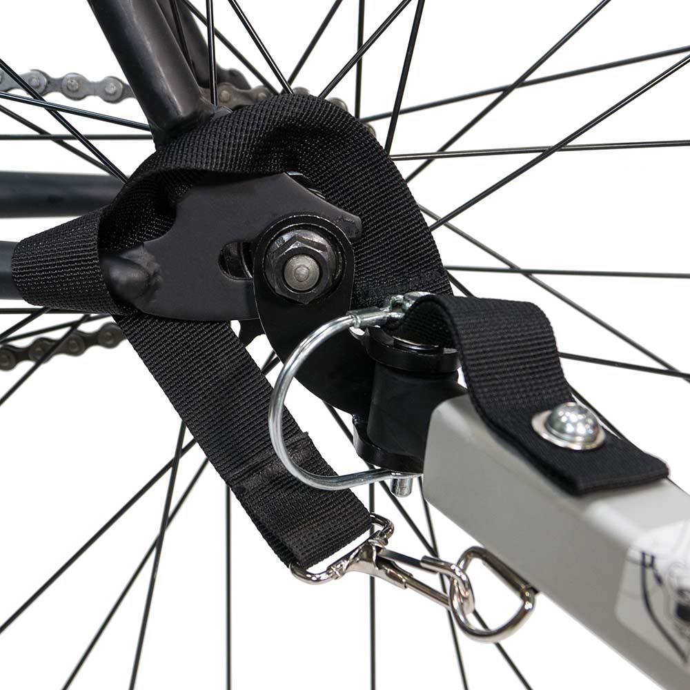 Burley Steel Hitch for bike trailers, durable metal accessory with easy installation and wide compatibility, shown attached to a bike.