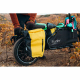 Burley waterproof bike pannier set with reflective patches and carry handles, designed for bike accessories and outdoor cycling.