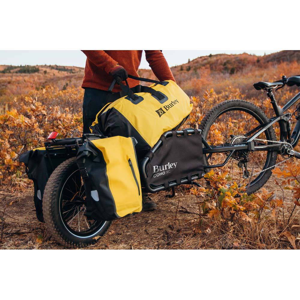 Burley 75L waterproof dry bag with roll-top closure, designed for Coho XC and Flatbed trailers, ideal for outdoor gear storage