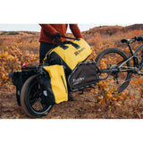 Burley 75L waterproof dry bag with roll-top closure, designed for Coho XC and Flatbed trailers, ideal for outdoor gear storage