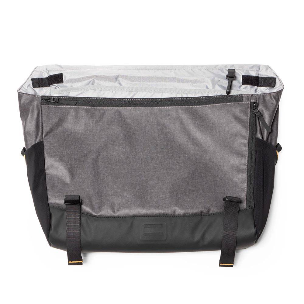 Burley Transit Messenger Bag with laptop sleeve and Travoy trailer clips, versatile accessories for commuting and outdoor activities.