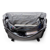 Burley Transit Messenger Bag with laptop sleeve and Travoy trailer clips, featuring durable fabric and adjustable strap.