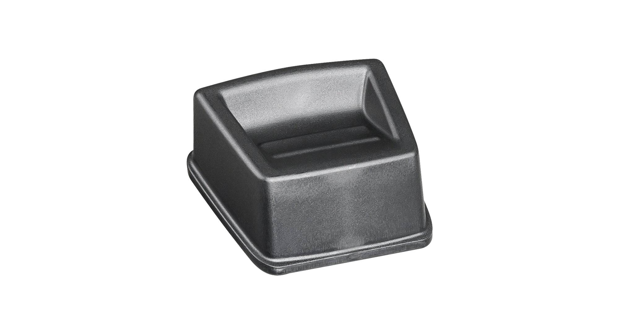 Black Trek Range Boost lock button cover, a replacement accessory, designed for easy installation on compatible bike components.