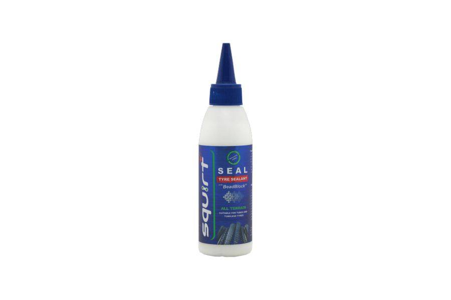 Workshop image of Squirt SEAL Tyre Sealant with BeadBlock for puncture protection on tubed and tubeless bike wheels.