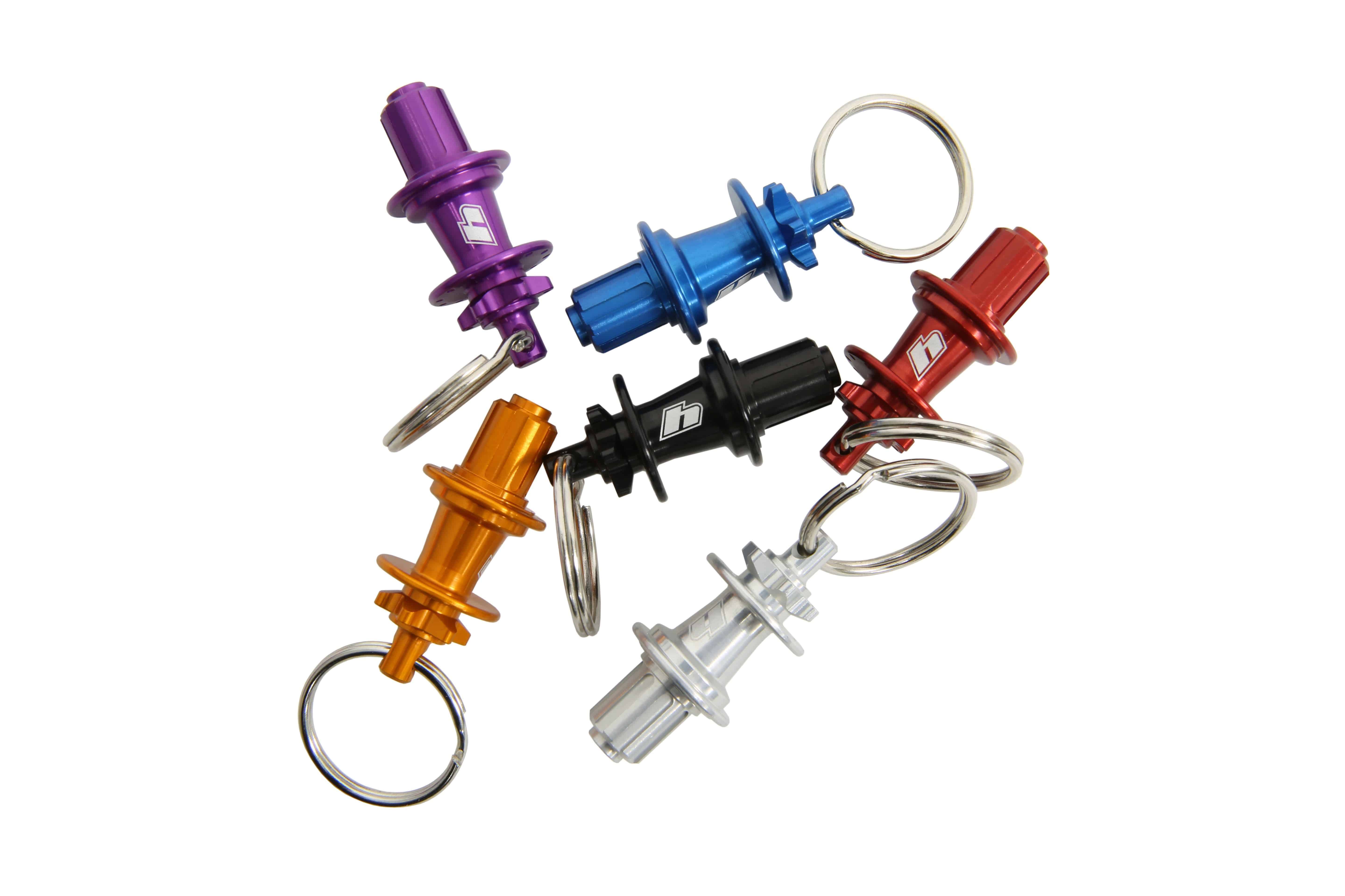 Hope Pro 5 Hub Keyring miniature replica in six colors, made in the UK, showcasing detailed bike hub design as a stylish accessory.