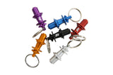 Hope Pro 5 Hub Keyring miniature replica in six colors, made in the UK, showcasing detailed bike hub design as a stylish accessory.