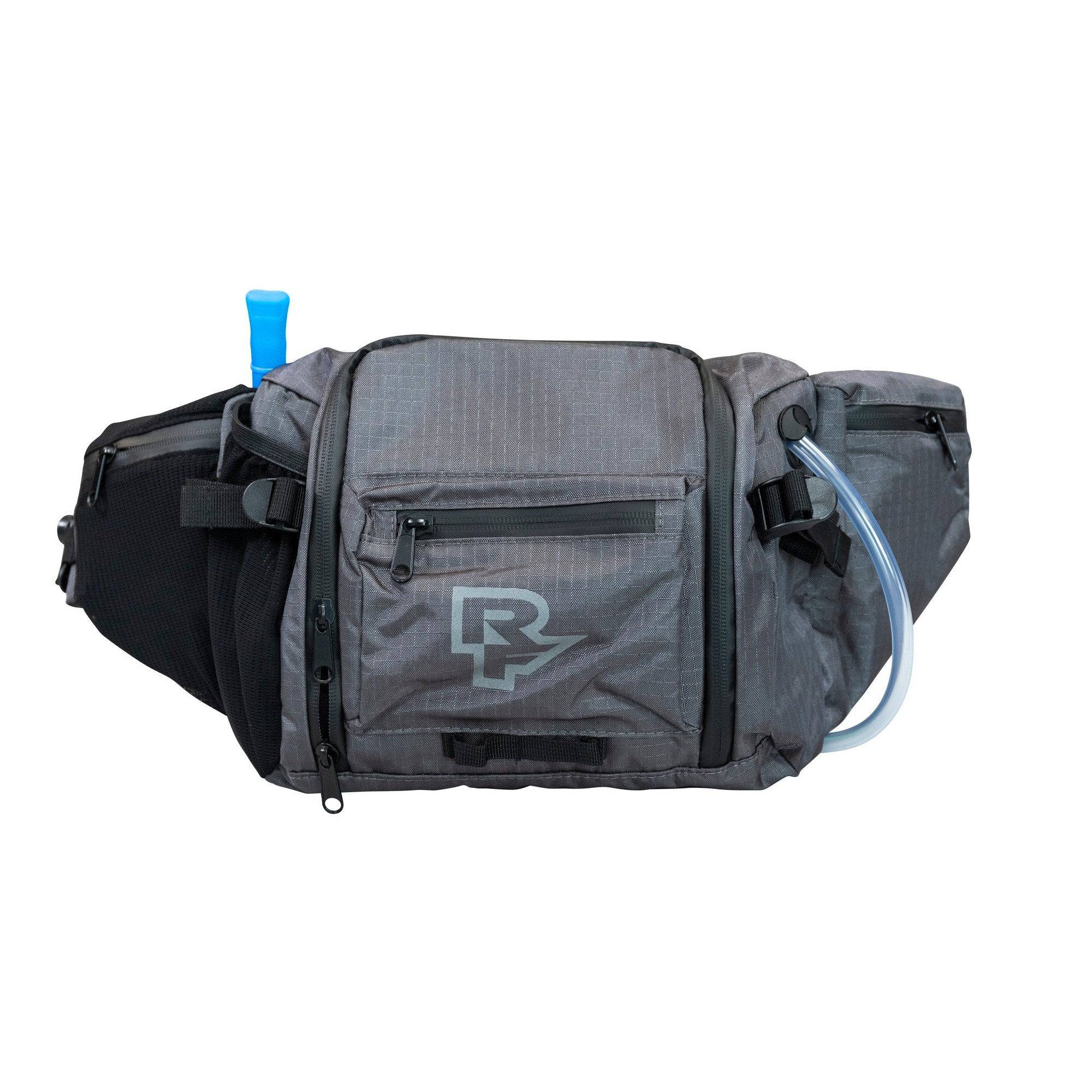 Race Face Stash 3L hydration hip bag with water-resistant pockets, tool bench, and compact design for cycling accessories.