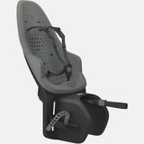 Thule Yepp 2 Maxi child bike seat mounted on bike rack with click-in system, designed for secure and comfortable riding.