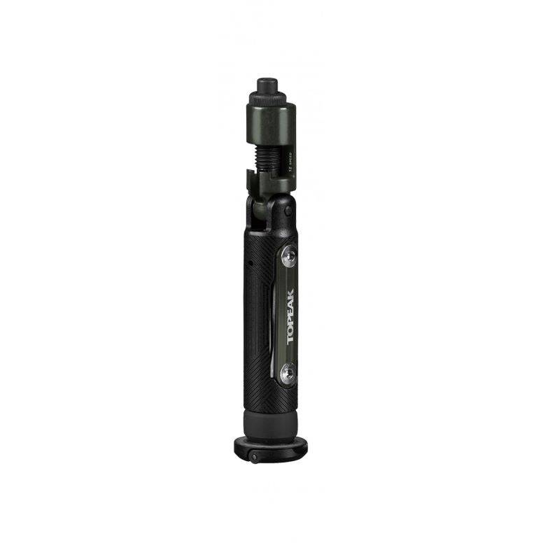 Topeak BB Hide n Tool black compact MTB bottom bracket multi-tool with 7 functions, shown in a workshop setting.
