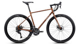 Genesis Croix de Fer 10 gravel bike with Shimano 2x9-speed drivetrain, featuring lightweight frame and rugged tires for versatile off-road riding.