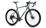 Genesis Croix de Fer 20 gravel bike featuring Shimano 2x10-speed drivetrain and TRP Spyre disc brakes, shown on a scenic trail.