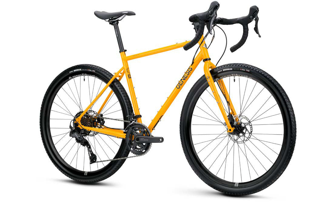 Genesis Croix de Fer 30 2026 gravel bike with Shimano 10-speed drivetrain and hydraulic disc brakes, shown from the side on a trail.