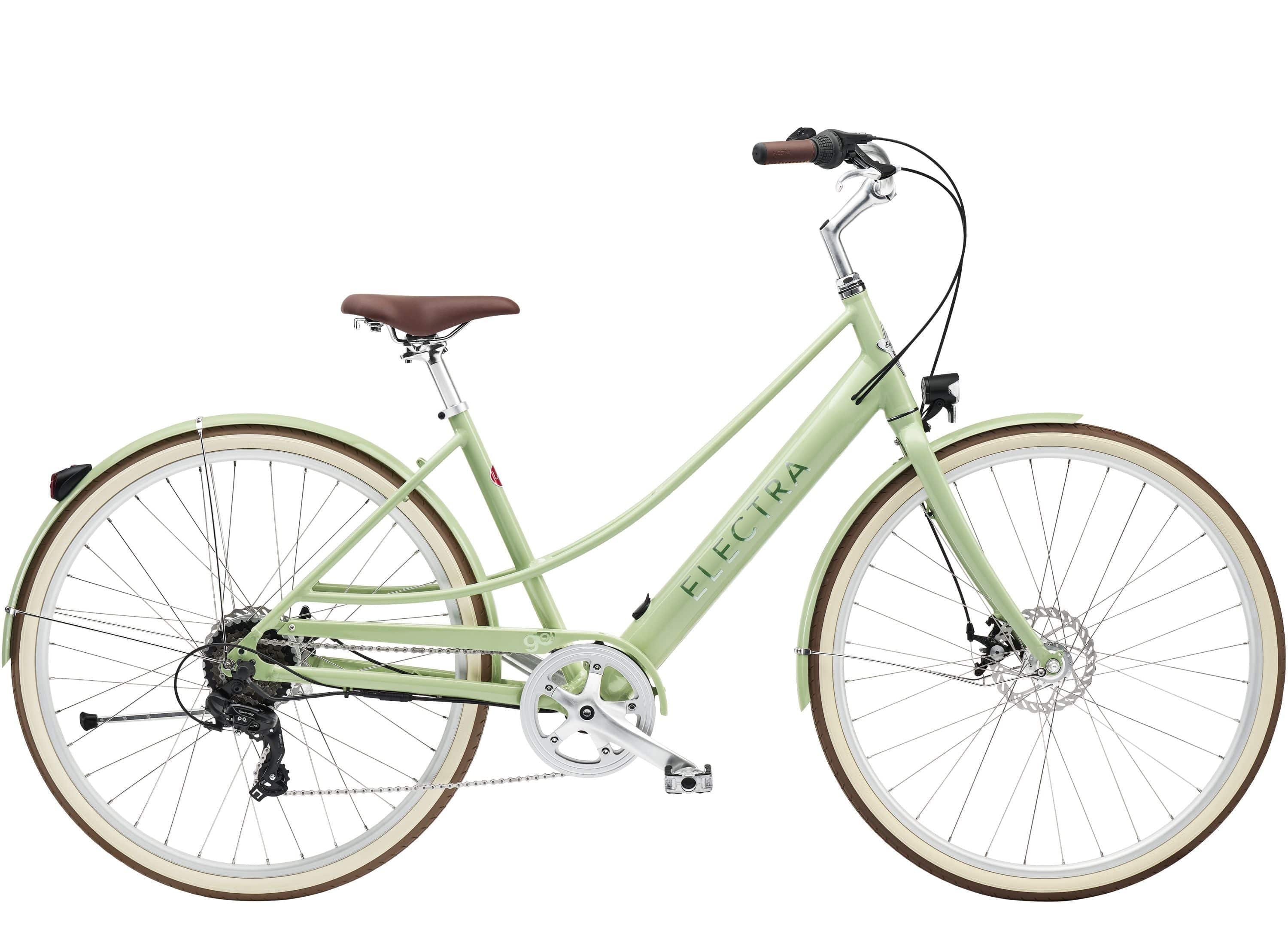 Electra Loft Go! 7D EQ step-thru electric hybrid bike with Shimano 7-speed gears and disc brakes, displayed outdoors.