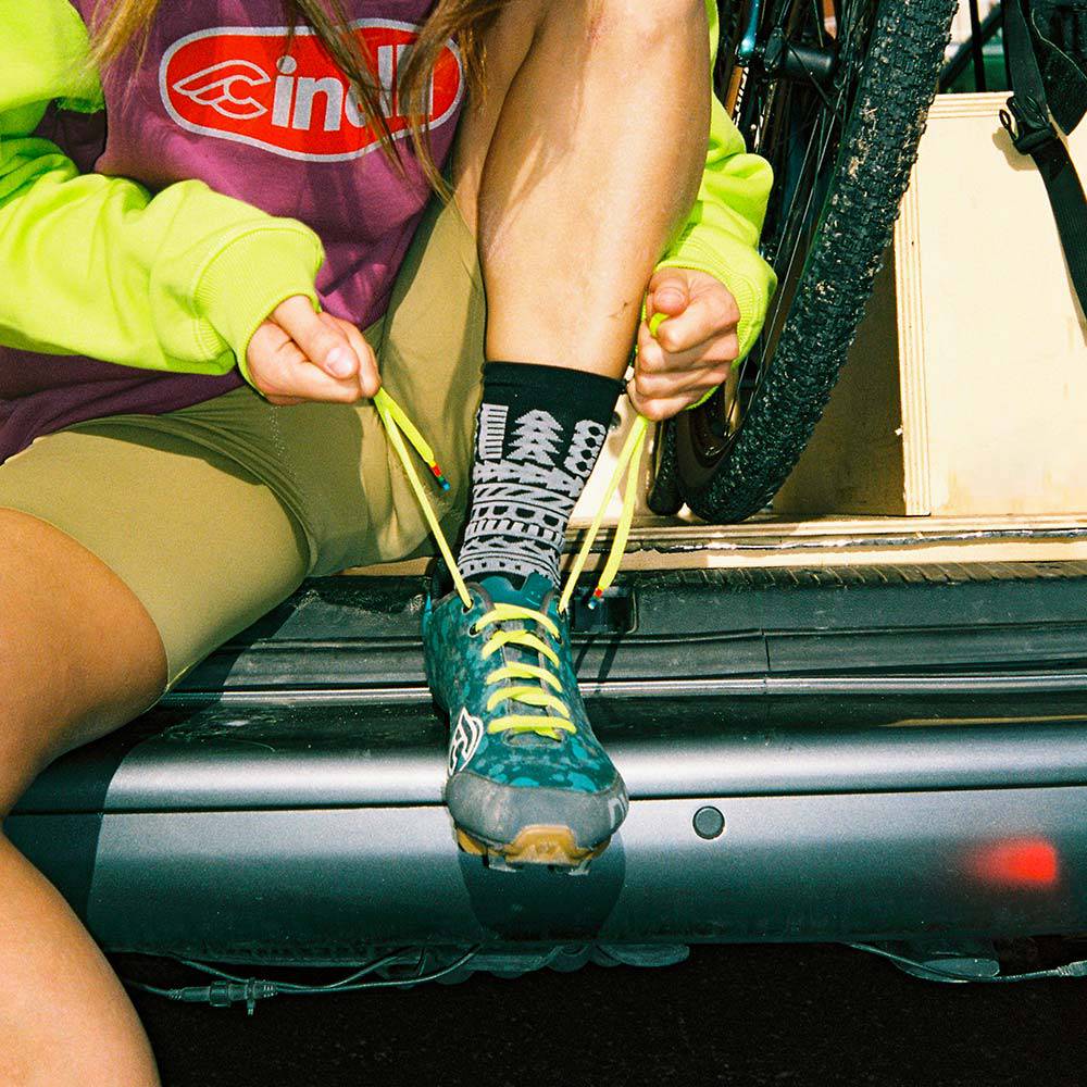 Unisex Cinelli Peace cycling socks with colorful peace sign design, made in Italy, designed for performance and comfort.