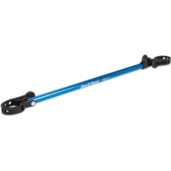 Park Tool HBH-3 extendable handlebar holder for bike repair stands, adjustable from 18 to 32 inches, in a workshop setting.
