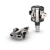 Garmin Rally XC110 single-sensing power meter pedals with Shimano SPD compatibility, shown mounted on a bicycle pedal.