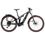 Trek Powerfly FS+ 4 Gen 5 mountain bike with full suspension and 800Wh removable battery, shown on trail.