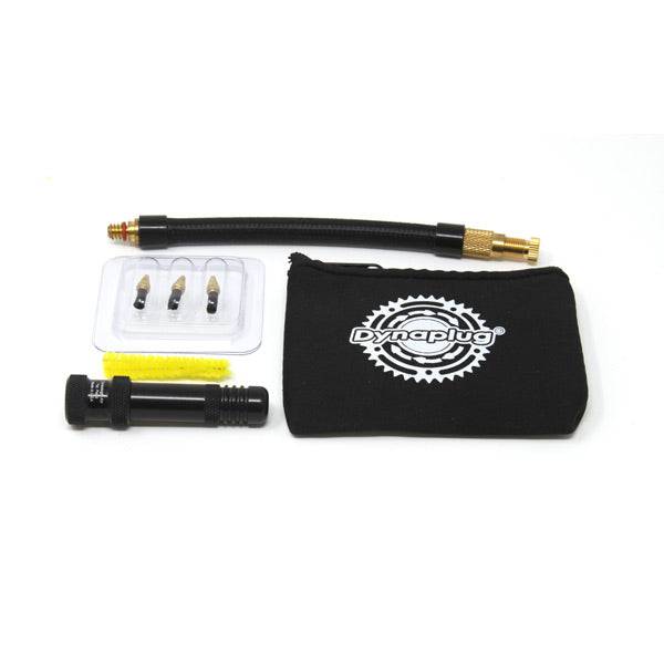 Dynaplug Air tubeless road tyre repair and inflation kit with black components and CO2 cartridge for quick bike tyre fixes.