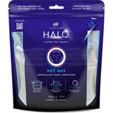 Finish Line Halo Hot Wax lubricant melts in a granular form for bike chains, shown in a workshop setting with a double boil bag.