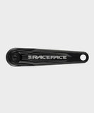 Black Race Face Ride crank arms for XC and trail bikes, CNC machined components for durable mountain biking performance.