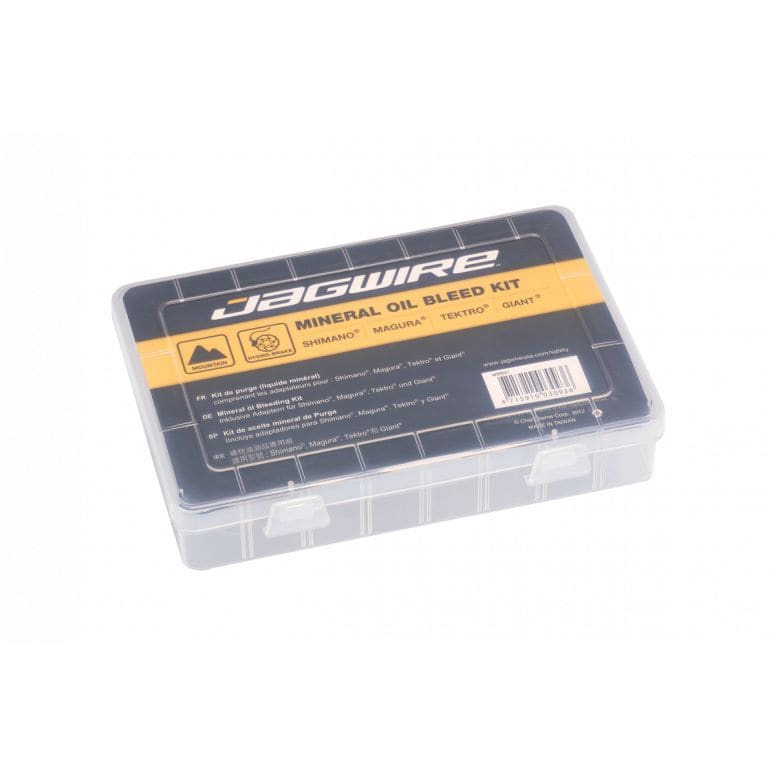 Jagwire Pro Mineral Oil Bleed Kit for hydraulic disc brakes, workshop setup with tools and mineral oil bottles.