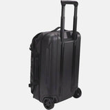 Black Thule Chasm Carry On wheeled suitcase with durable construction and oversized wheels for easy travel.
