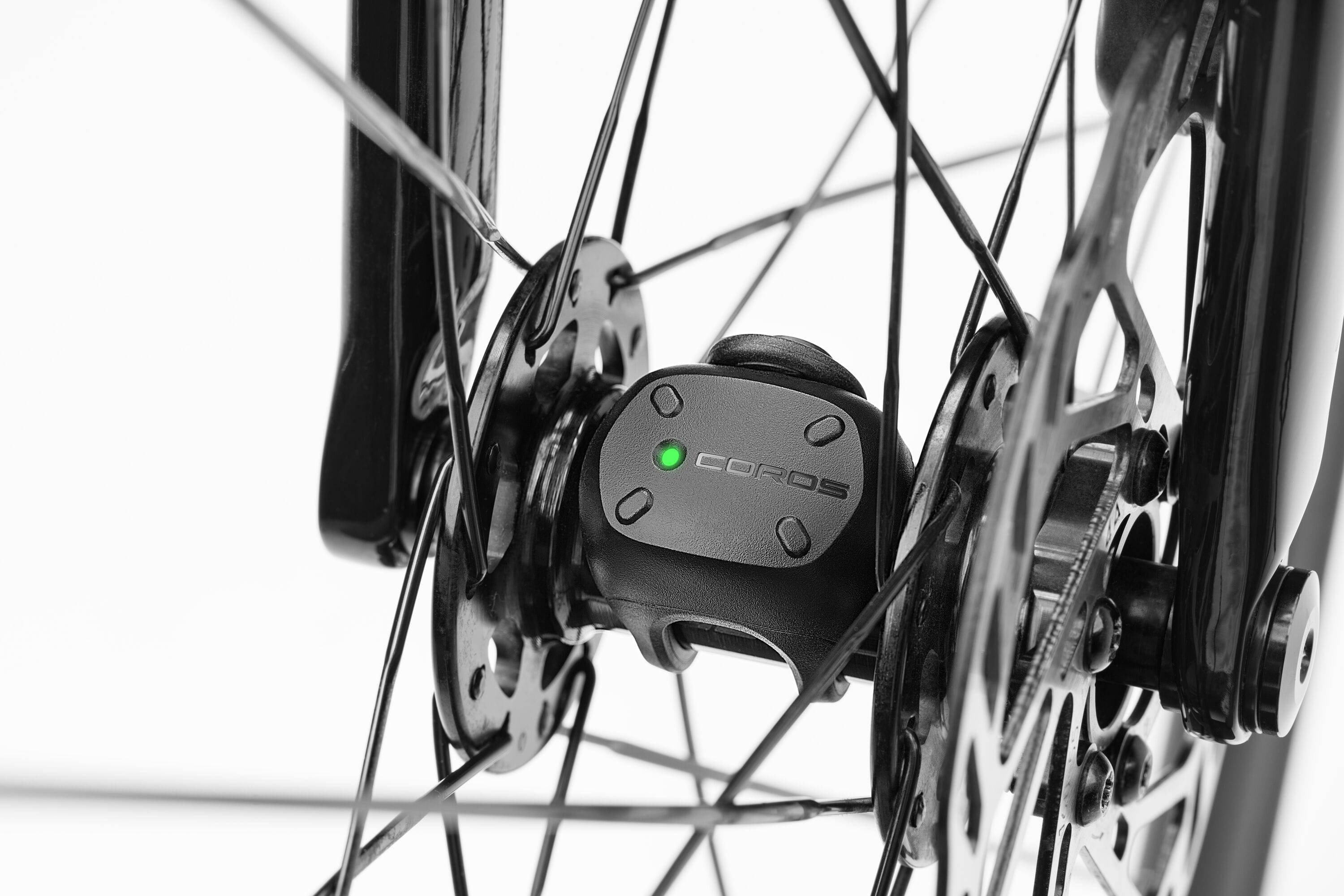 Coros Bike Speed Sensor accessory showing compact Bluetooth GPS-free speed and distance sensor for bicycles.