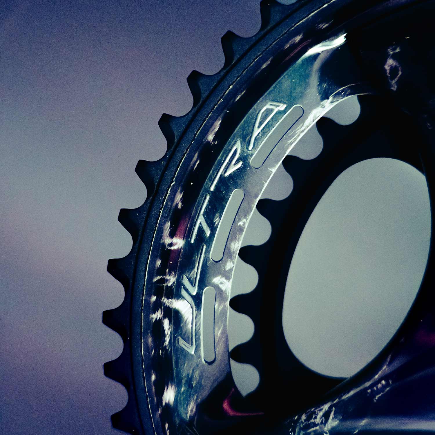 Campagnolo Super Record Ultra 13x chainring for road cycling with electronic shifting, showing the detailed black component with branding.