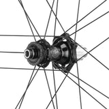 Campagnolo Shamal Dual Profile 2-Way C23 disc road and gravel wheels with black rims and silver spokes, mounted on a bike.