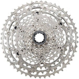 Shimano Deore CS-M5100 11-speed MTB cassette with Hyperglide sprockets, showing metal cogs and gear teeth.