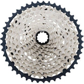 Shimano SLX CS-M7100 12-speed MTB cassette with Hyperglide sprockets showing gear teeth and compact design.
