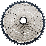 Shimano SLX CS-M7100 12-speed MTB cassette with Hyperglide sprockets showing gear teeth and compact design.
