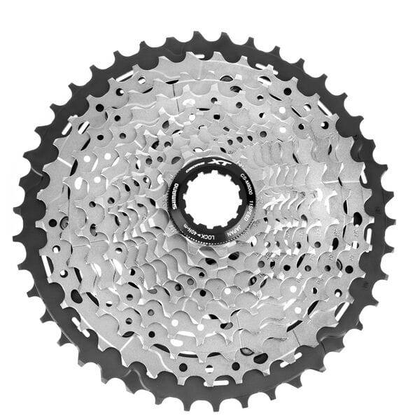 Shimano Deore XT CS-M8000 11-speed MTB cassette with Hyperglide for smooth shifting, shown with sprockets and gear details.