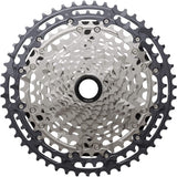 Shimano Deore XT CS-M8200 12-speed MTB cassette with 10-51T Hyperglide sprockets, mounted on a bike drivetrain component.