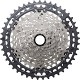 Shimano Deore XT CS-M8200 12-speed MTB cassette with 10-51T Hyperglide sprockets, mounted on a bicycle drivetrain component.