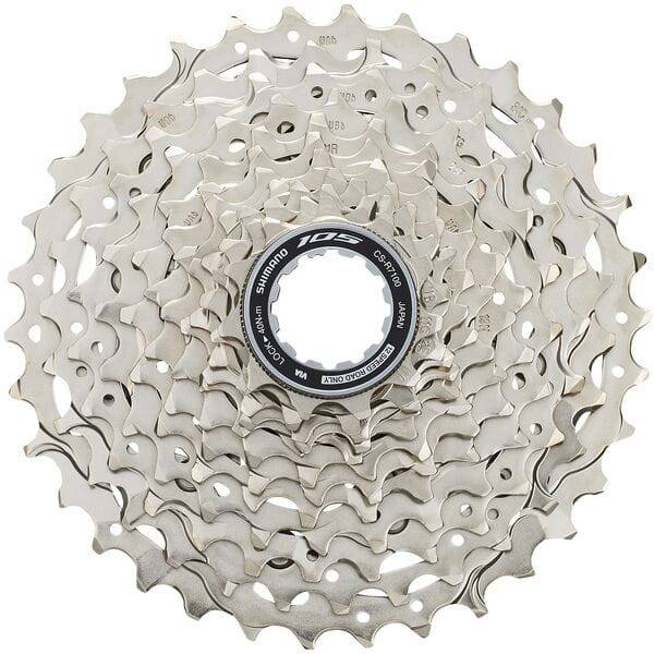 Shimano 105 CS-R7101 12-speed bicycle cassette with 11-34T gears and Hyperglide+ technology, mounted on a bike wheel.