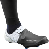 Shimano S-Phyre windproof unisex toe covers for cycling shoes, shown in black, designed to keep feet warm and protected during rides.