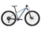 Liv Tempt 2 mountain bike with ALUXX frame, 27.5/29-inch wheels, and 1x drivetrain, shown from side view.
