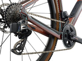 Liv Devote Advanced Pro 2026 women’s gravel racing bike with adjustable wheelbase, black frame, and rugged tires.