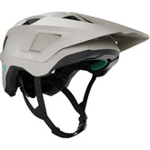 Lazer Lupo KinetiCore trail helmet with adjustable fit and integrated visor, shown in a natural outdoor setting.
