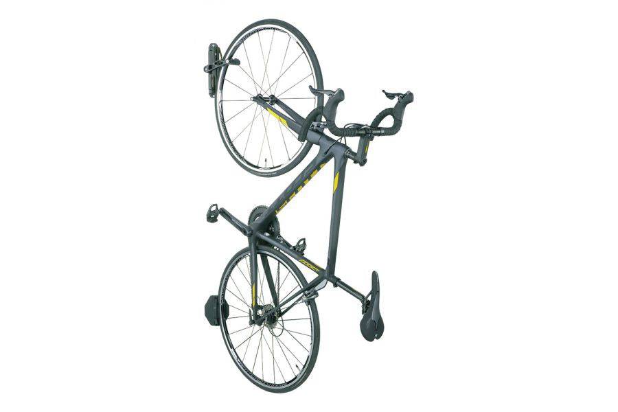 Topeak Swing-Up wall-mounted bike holder in black with rubber bar and rear wheel pad for secure bike storage