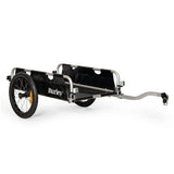 Burley foldable two-wheel cargo bike trailer with flatbed for hauling bulk items, shown attached to a bicycle.