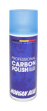 Morgan Blue Carbon Polish aerosol spray for bike paint and chrome cleaning with protective shine, shown in a workshop setting.