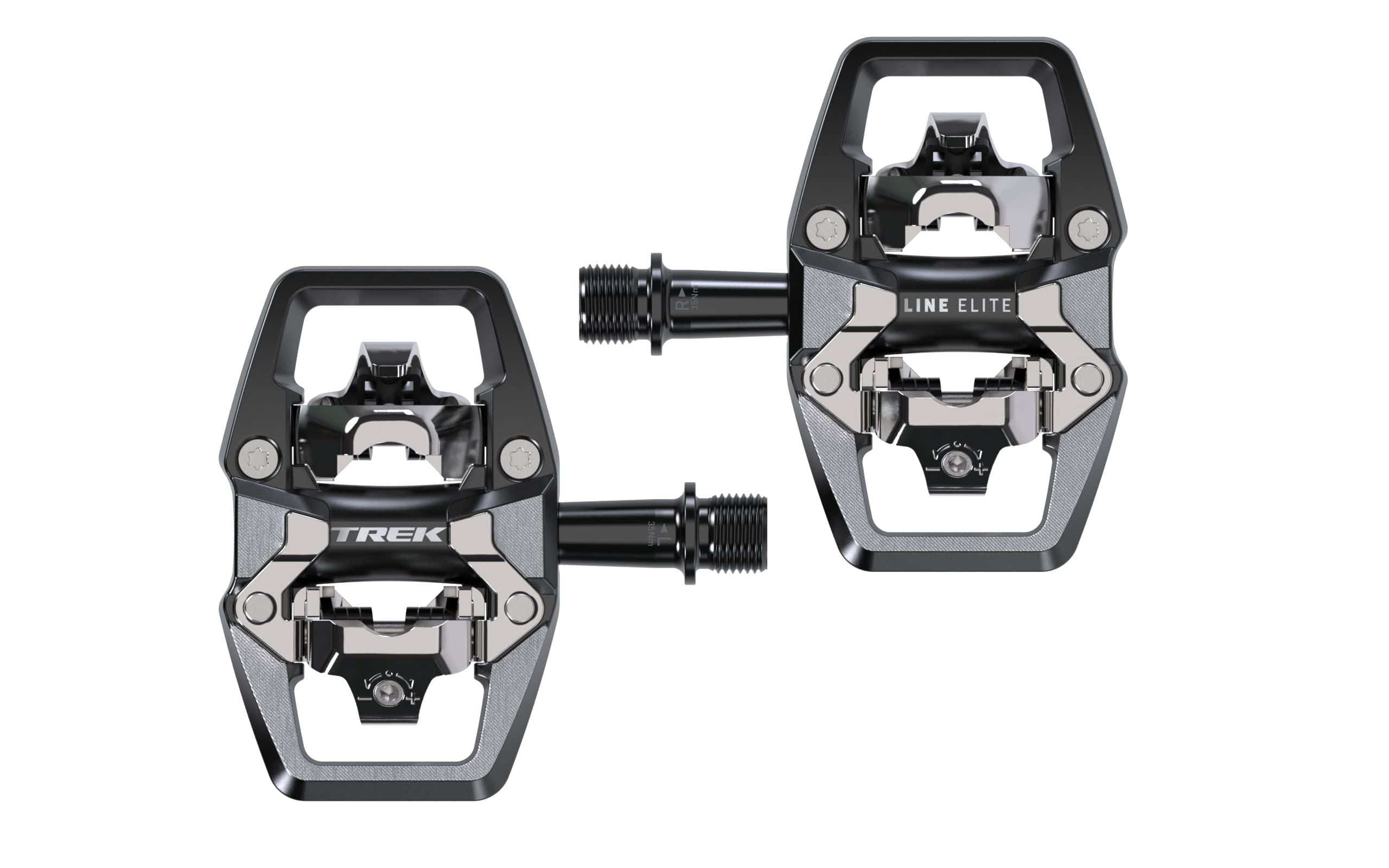 Trek Line Elite black clipless cycling pedals with 9/16" spindle for road and mountain biking, mounted on a bike pedal.