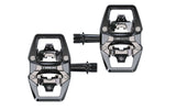 Trek Line Elite black clipless cycling pedals with 9/16" spindle for road and mountain biking, mounted on a bike pedal.