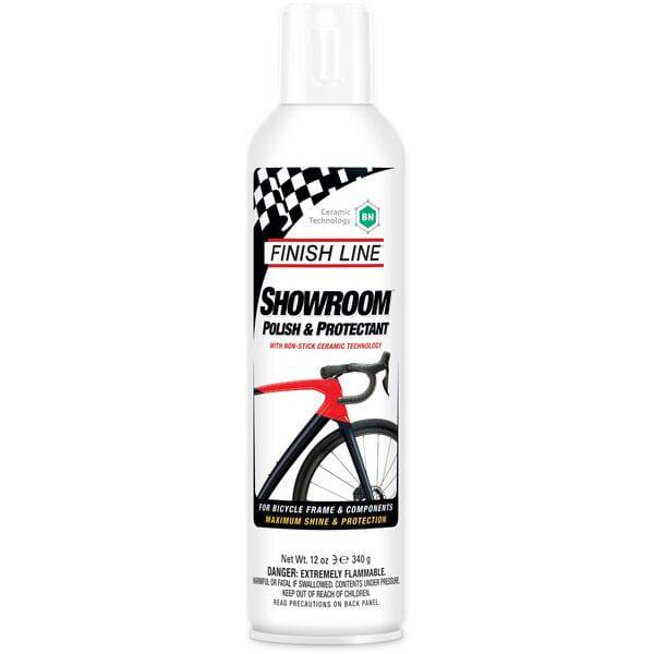 Finish Line Showroom Polish Ceramic Tech aerosol bike cleaner and protector in a workshop setting, packaged in a box of six.